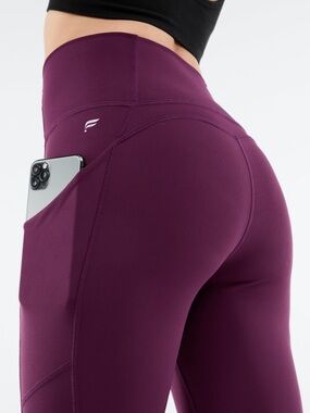 Fabletics High-Waist Pocket 7/8 Leggings in Deep Plum